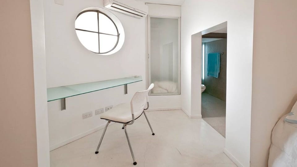 Loft  desk and closet.  Note entrance to attached bath.