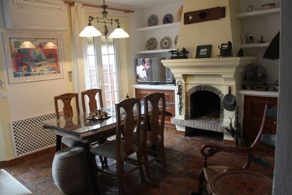 Cosy living room with cold and warm air conditioner. Andalucian style decoration