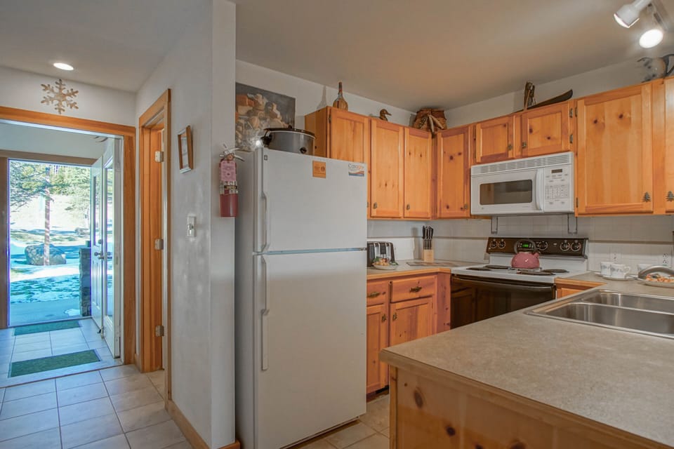 Well-stocked kitchen with an ample supply of cookware and service ware.