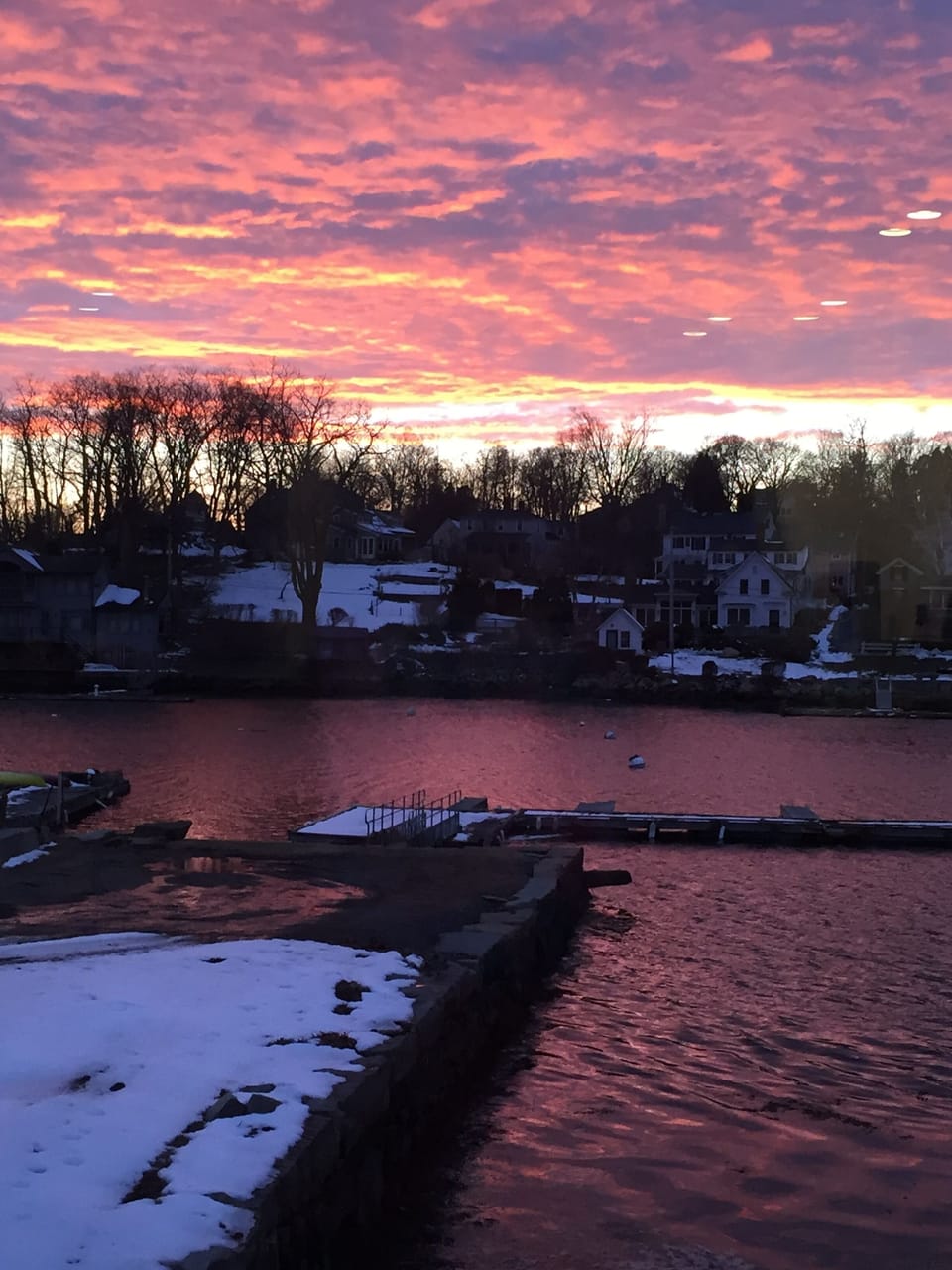 Lobster Cove sunset while having a glass of wine