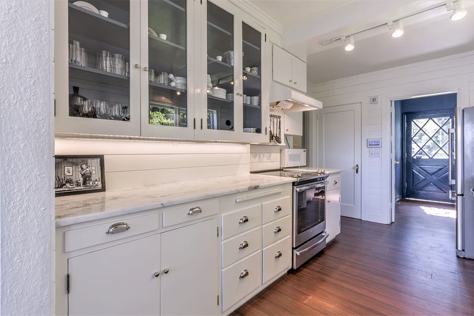 updated kitchen with new appliances and quartzite counters