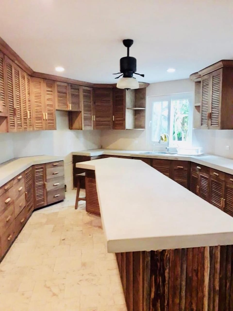 Kitchen with new mayan cement countertops and reclaimed wood.