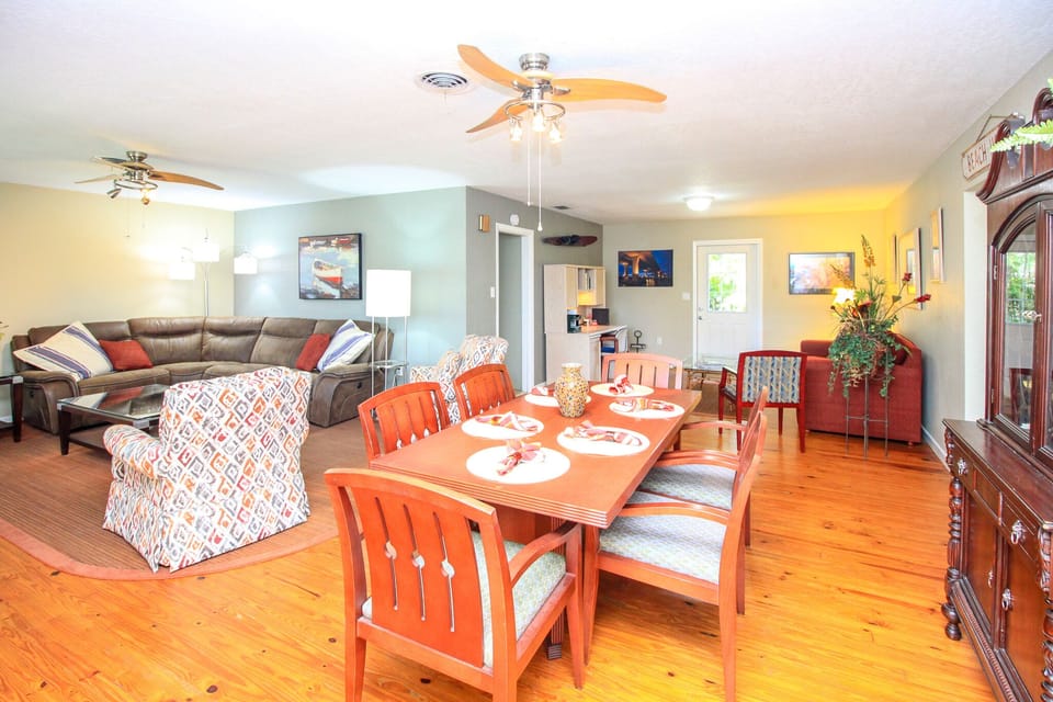 large open plan with living, dining, office, family room. All wood floors.
