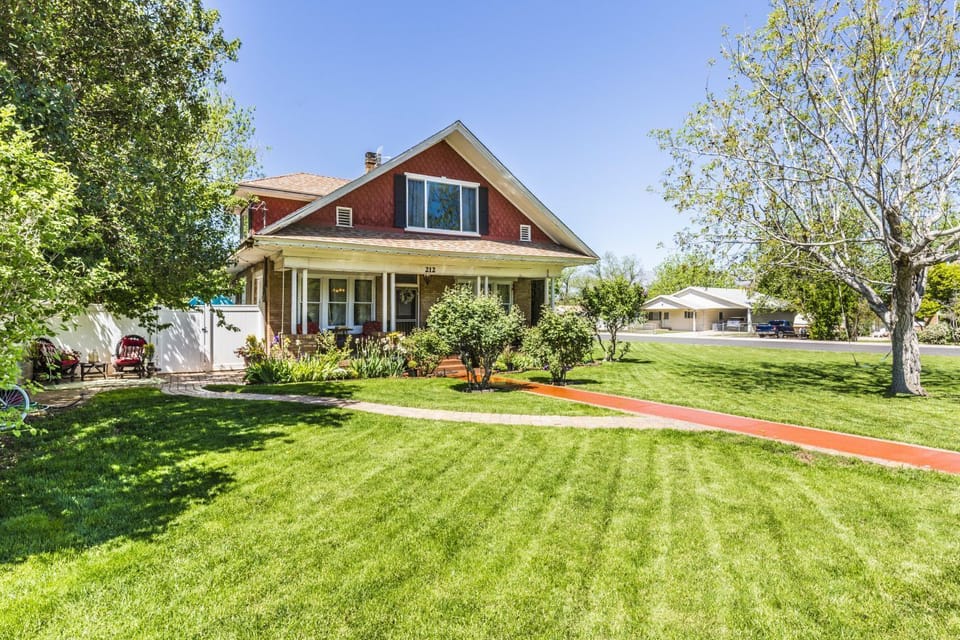 Park in front and enter the gate on the side of the house or use covered parking