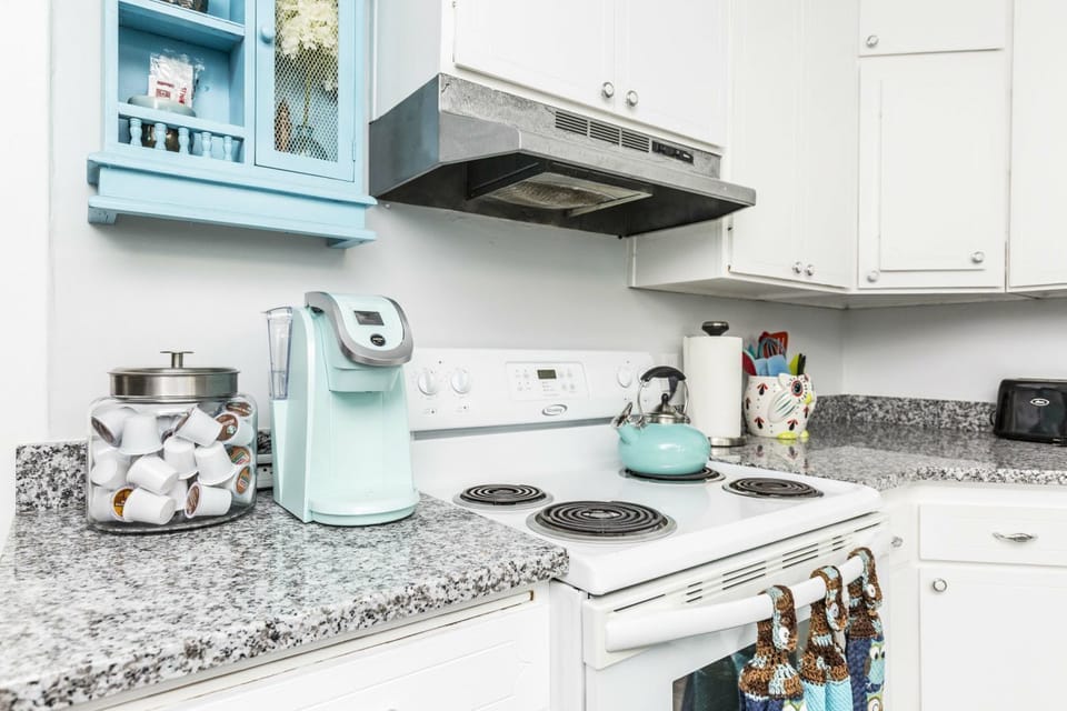 Stove, oven coffee pot, tea kettle,  pot and pans, and everything for meal prep.