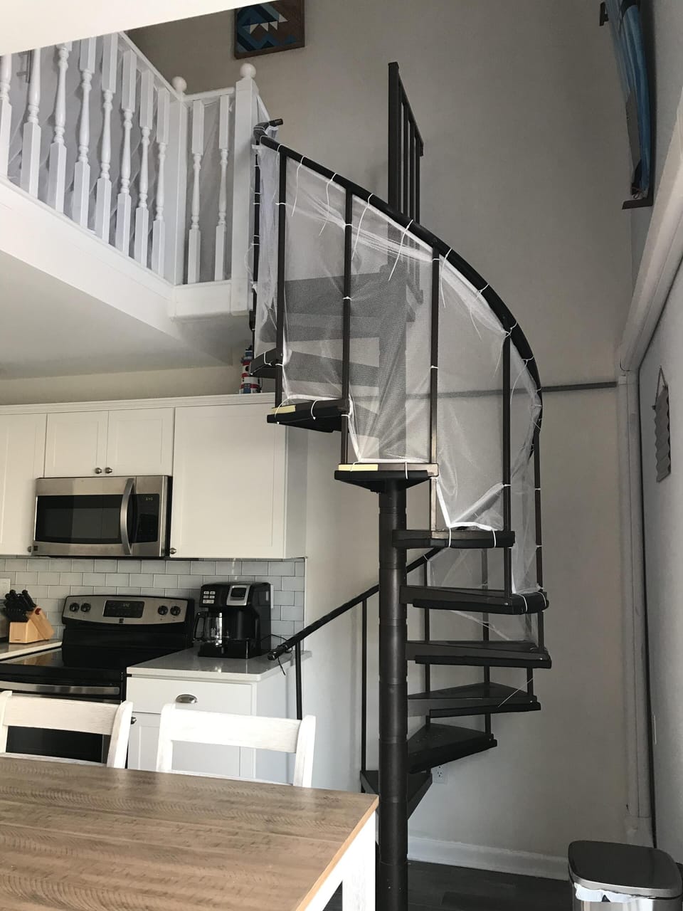 Spiral staircase leading to the loft space.