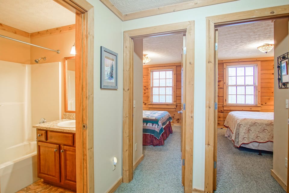 Here you can see 2 bedrooms on the top level and the shared bathroom in the hall.