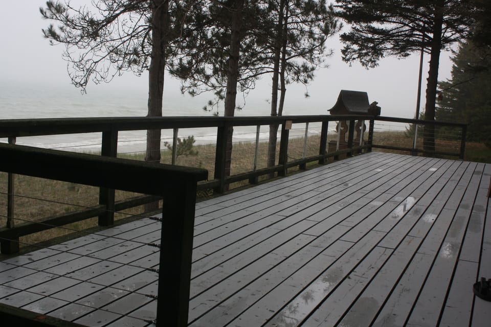 Comfortable chairs are provided on this freshly stained deck.