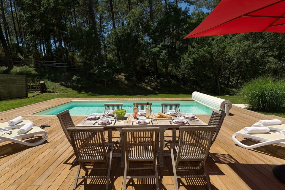 Enjoy a glass of wine with the sunshine by your private pool!