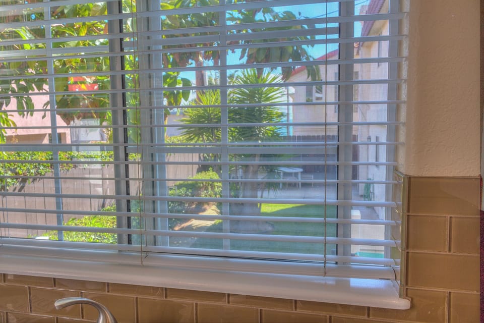 Carlsbad Beach Cottage peek of ocean from kitchen window