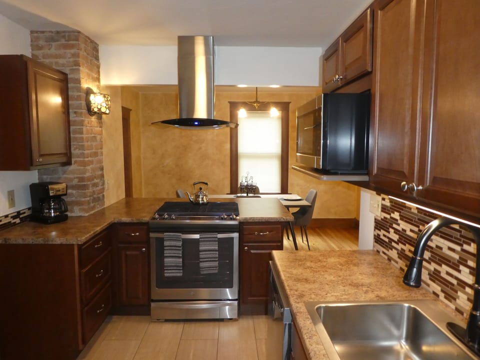 Updated in 2016 with new everything! Gas range, Hood, tile floor, etc