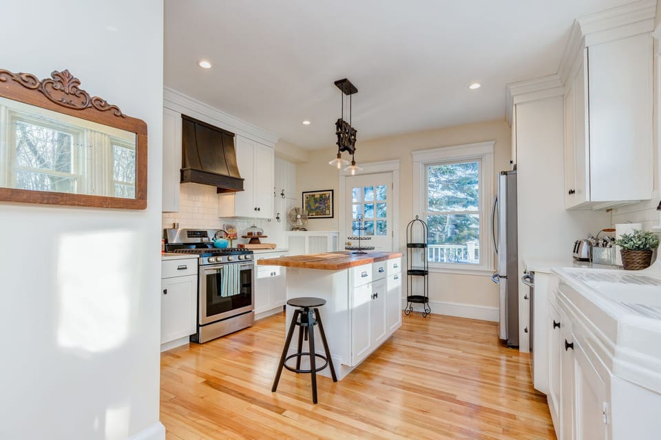 Fully loaded kitchen with dishes, utensils and glassware, all service for 32.