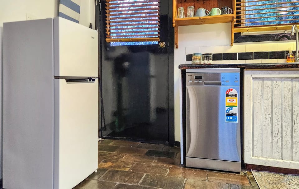 Kitchen with new fridge and dishwasher (July 2024)
