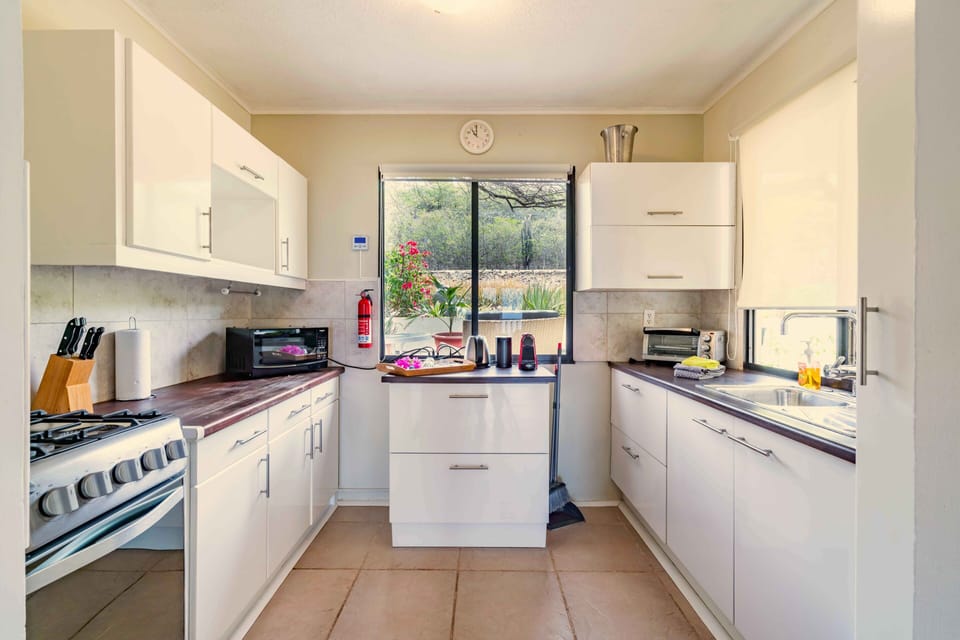 Fully equipped kitchen with microwave, toaster oven, coffee makers and more