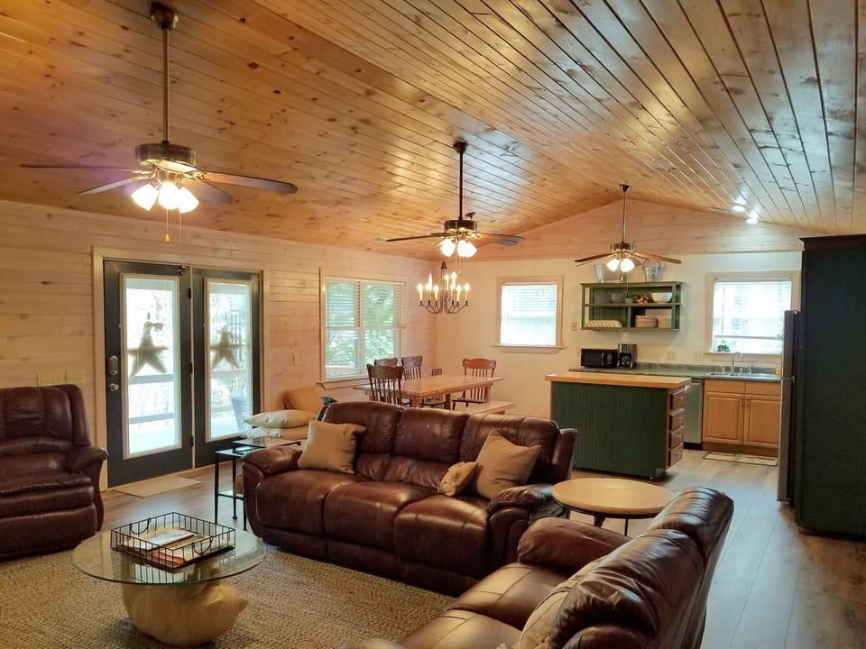 Large, open floorplan with family room and kitchen all under vaulted ceiling. 