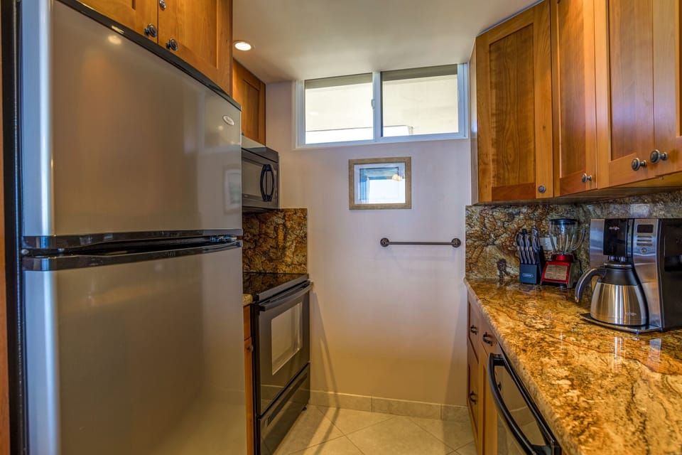 Full sized fridge, electric range and microwave oven.
