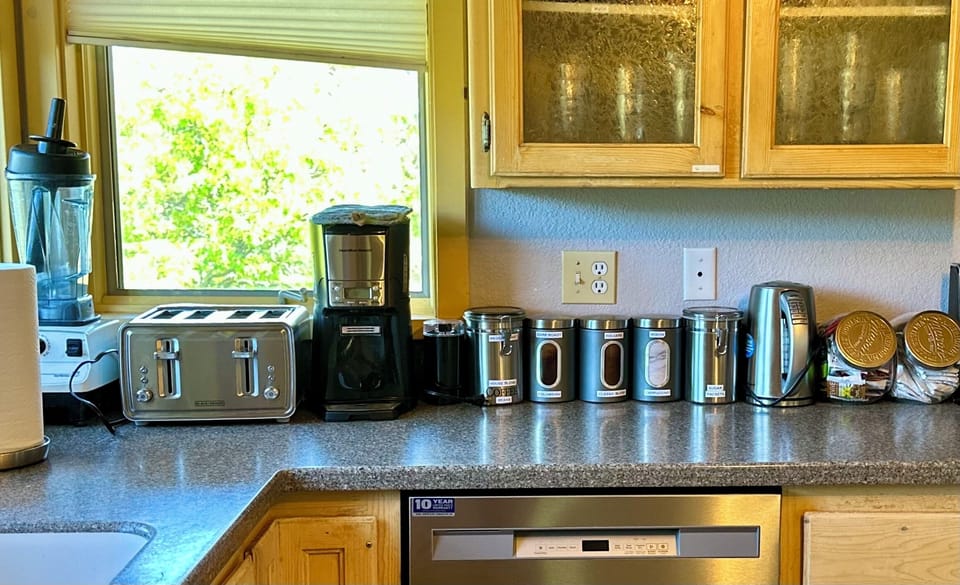 Kitchen, with 3 types of Coffee, assortment of Teas, Hot Chocolate and Mocha mix