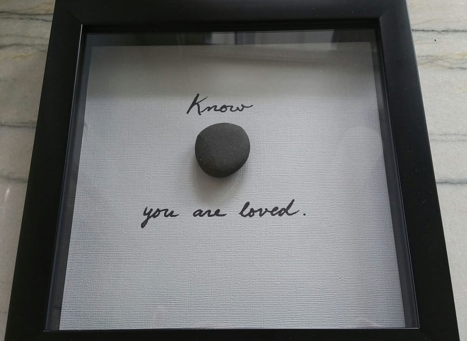 Feel the love!  This is hanging in the Master bedroom w/stone from Harbert Beach