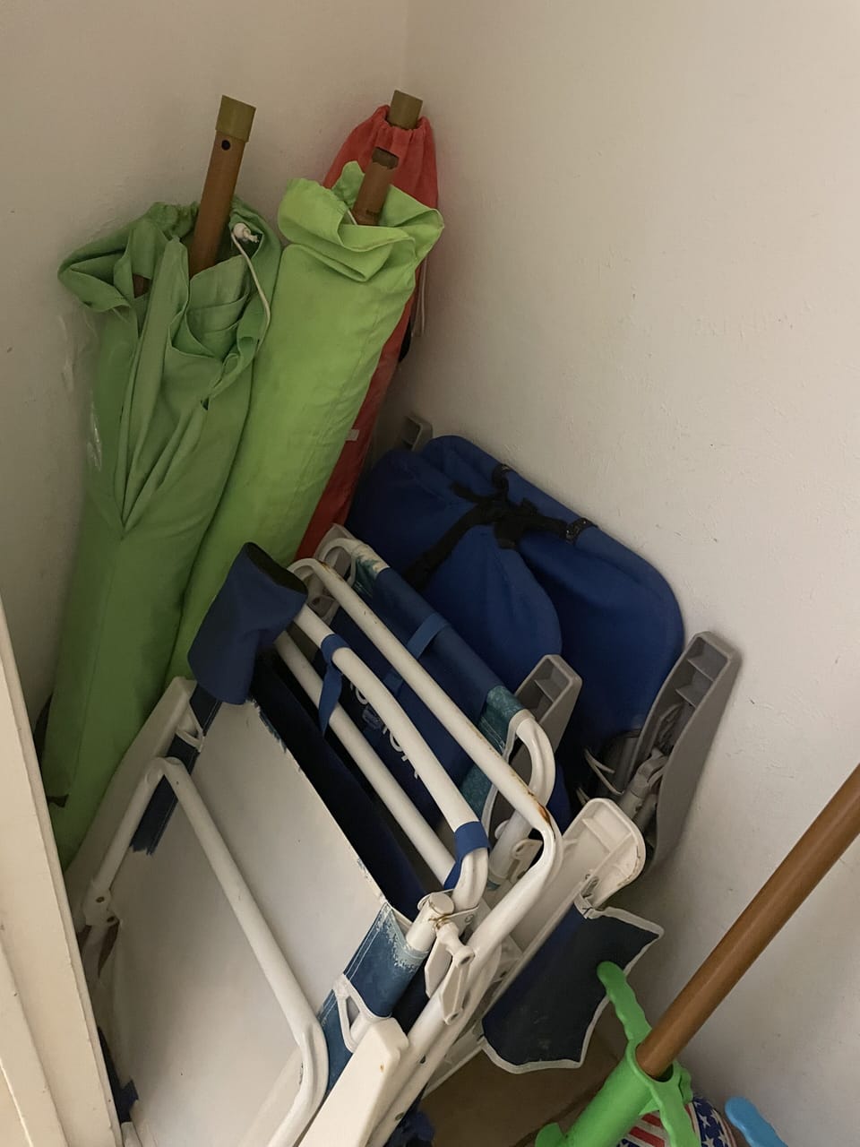 Hall Closet with 3 Beach Umbrellas, 4 Beach Chairs, 5 Quart cooler