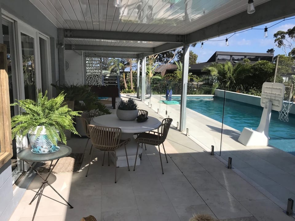 Outdoor area by pool view from Pergola