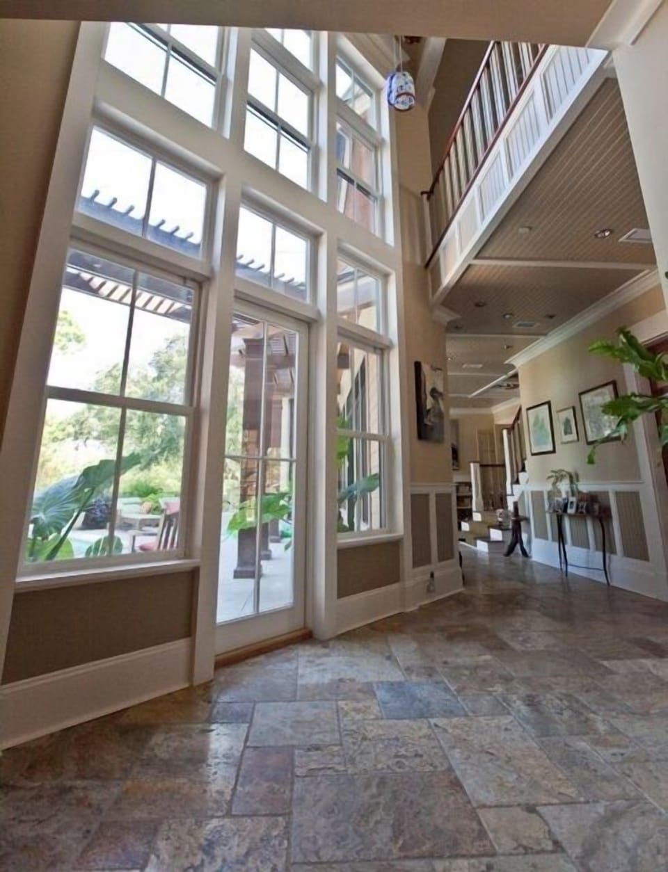 Foyer area and french doors to back deck pool and BBQ area.