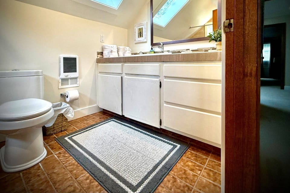 The bathroom is recently updated and decorated.