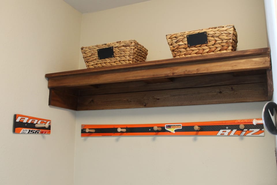 Entryway with storage cubby, bench and ski rack