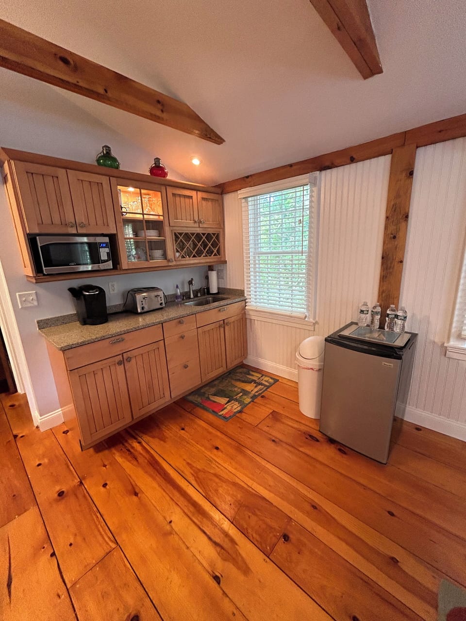 Full service kitchenette with full-size refrigerator on first floor