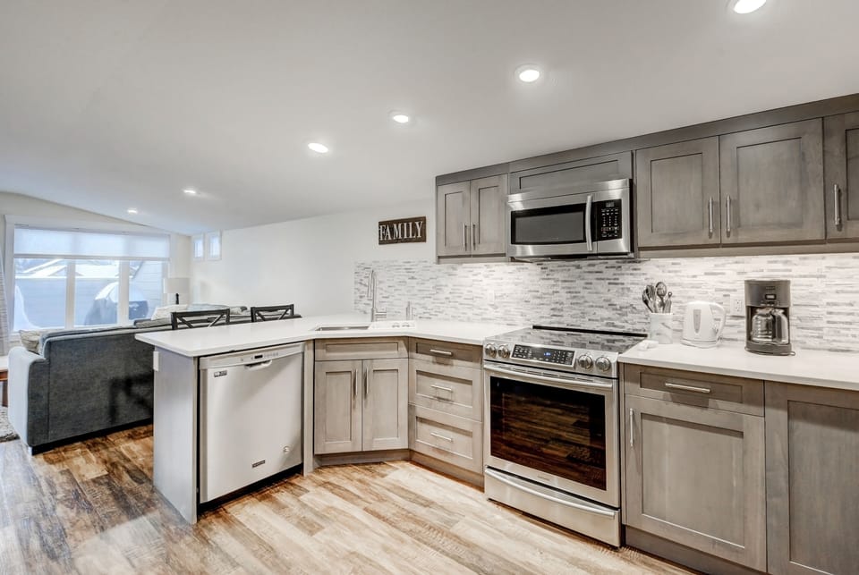 Chef's kitchen, fully equipped with stainless steel appliances.