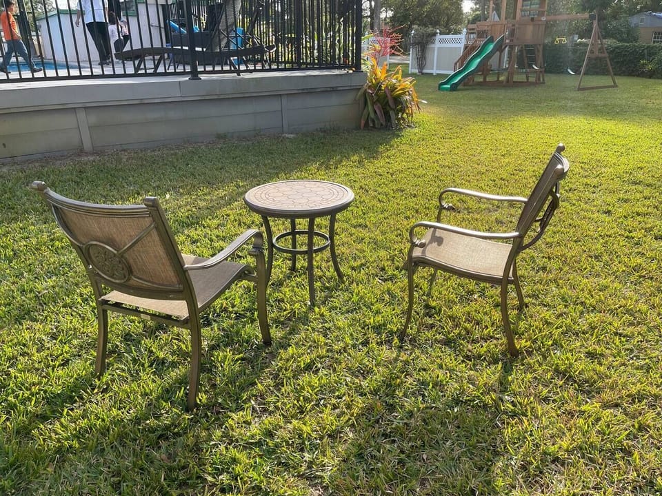 The backyard is fully fenced and is shared by eight units.  Parents can relax while their kids roam around freely.  The pool is fenced and has a child-resistant gate.