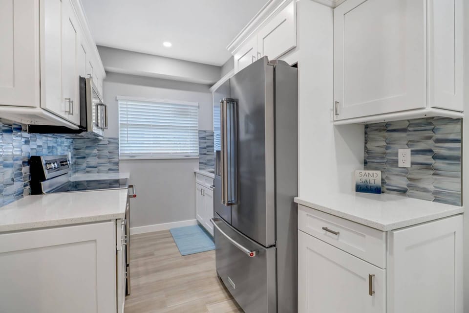 The gorgeous kitchen comes well stocked with all the cookware, dinnerware, glasses and silverware needed to prepare and serve meals during your stay.