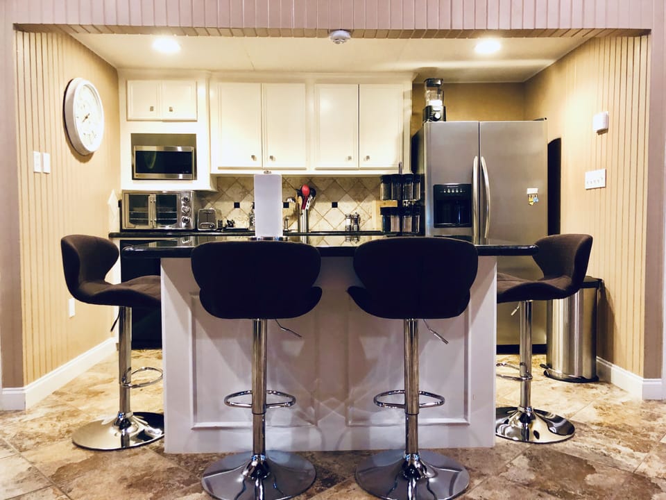 Granite island with seating for four. 