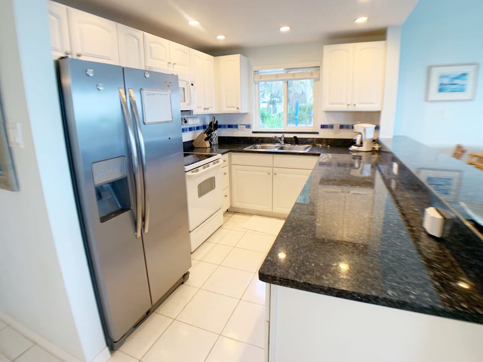 Squeaky clean kitchen comes stocked with everything you need!
