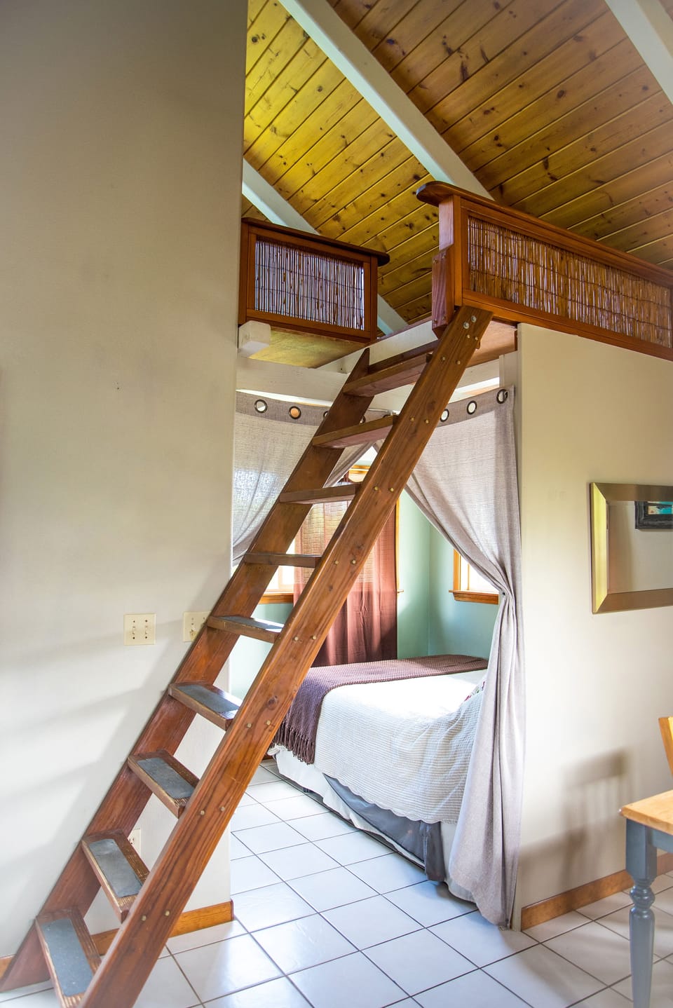 stairs to loft, and bed downstairs