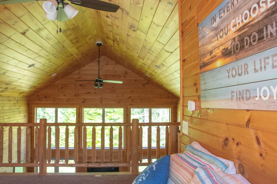 Loft with a queen bed.

