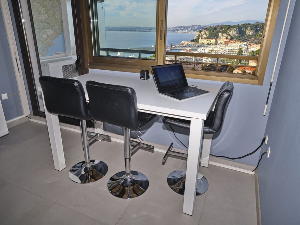 Large and tall dining table with a nice view of the Mediterranean Sea.