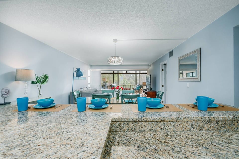 Gorgeous stone counters in the kitchen open to the main room