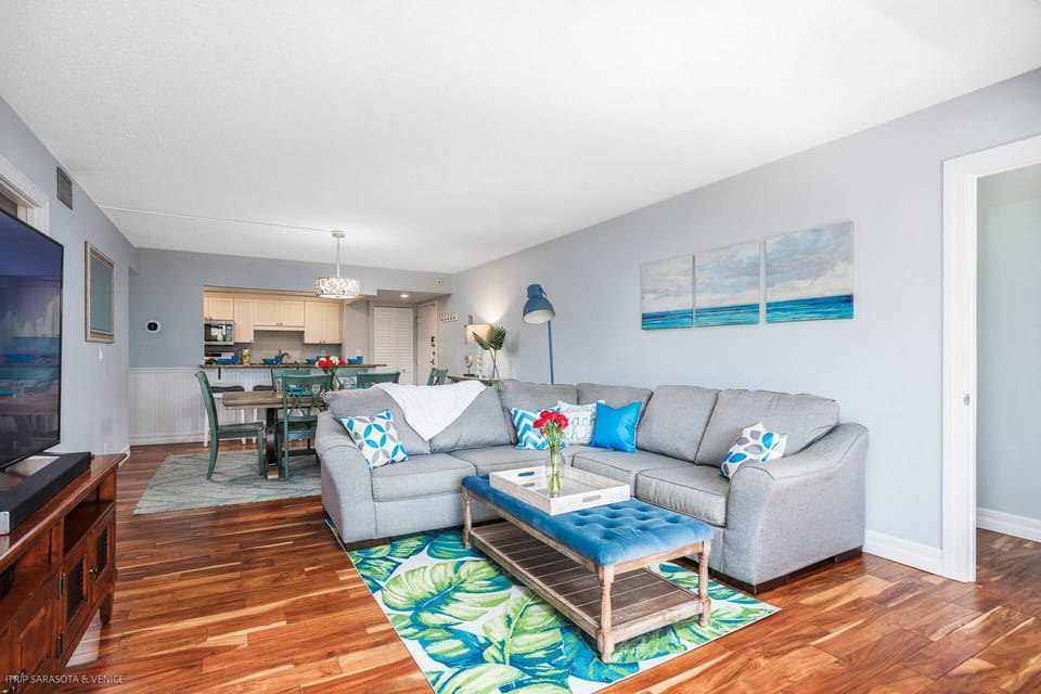 Large corner sofa in the main room with a Smart TV and cable