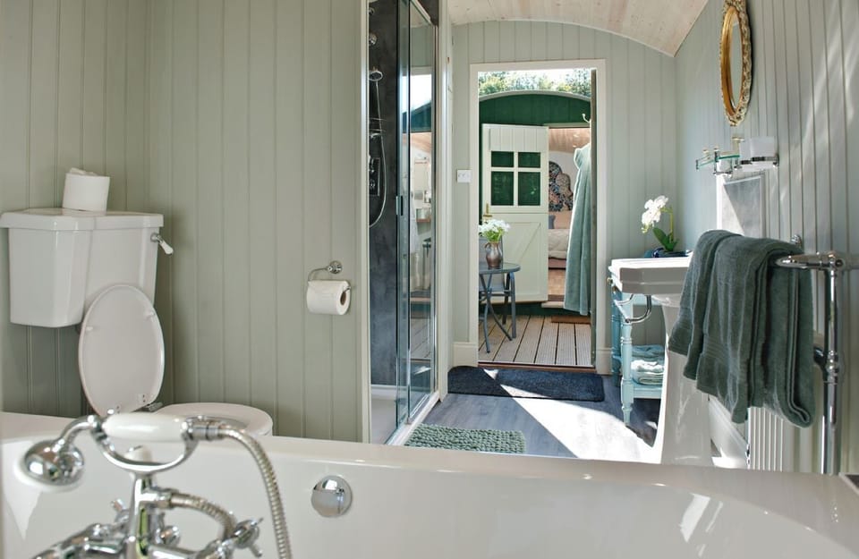 The bathing and dressing hut with double ended bath and walk in shower