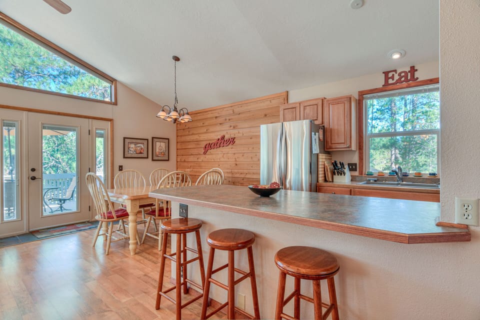 Another view of the kitchen and dining area