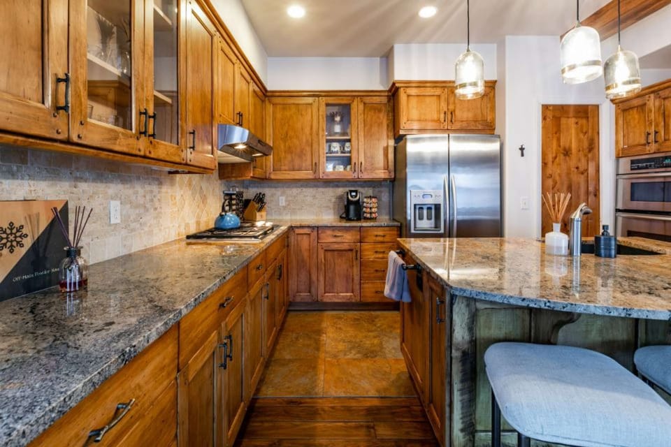Seat 3 more guests at the adjacent island. The chef of the group will appreciate the gas stove, numerous pots &amp; pans, tupperware, spices, slow-cooker and other small appliances.
