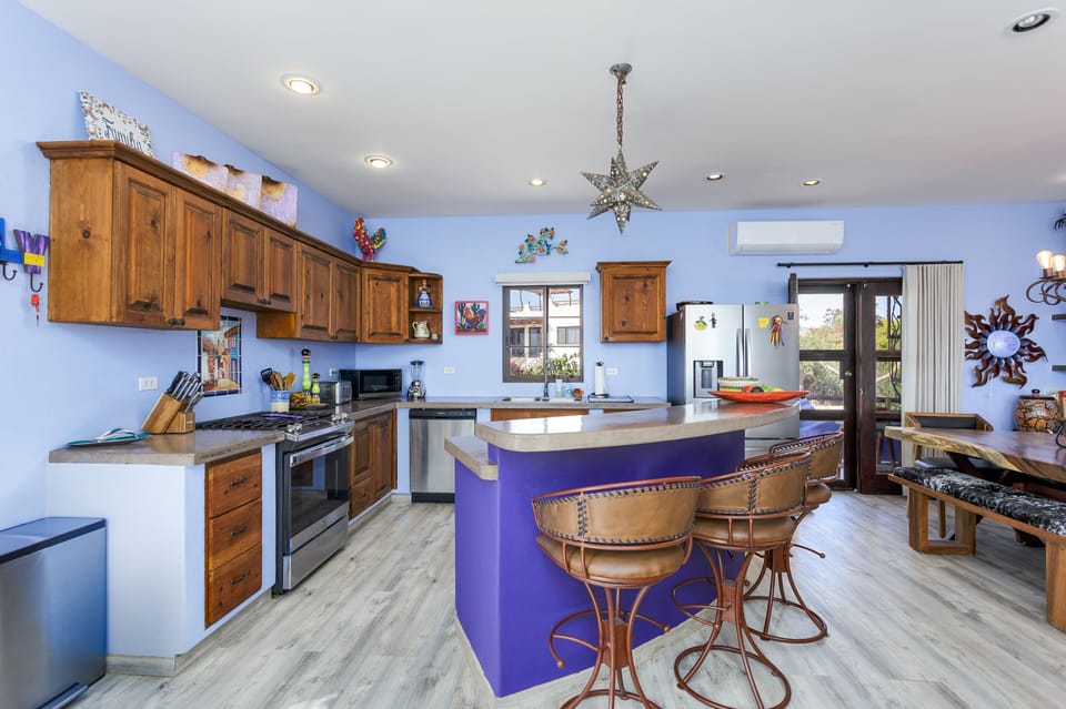 Kitchen, dining and bar area.