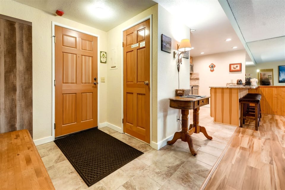 Front entrance with bench for taking off shoes and coat rack