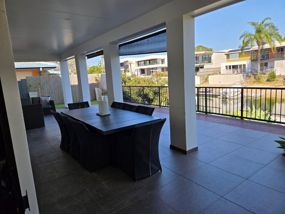 Outdoor dining and lounge overlooking canal
