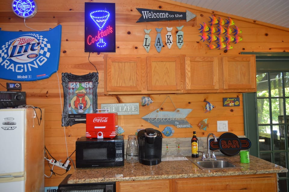 Outdoor bar next to game room, fire pit area and large deck with seating!
