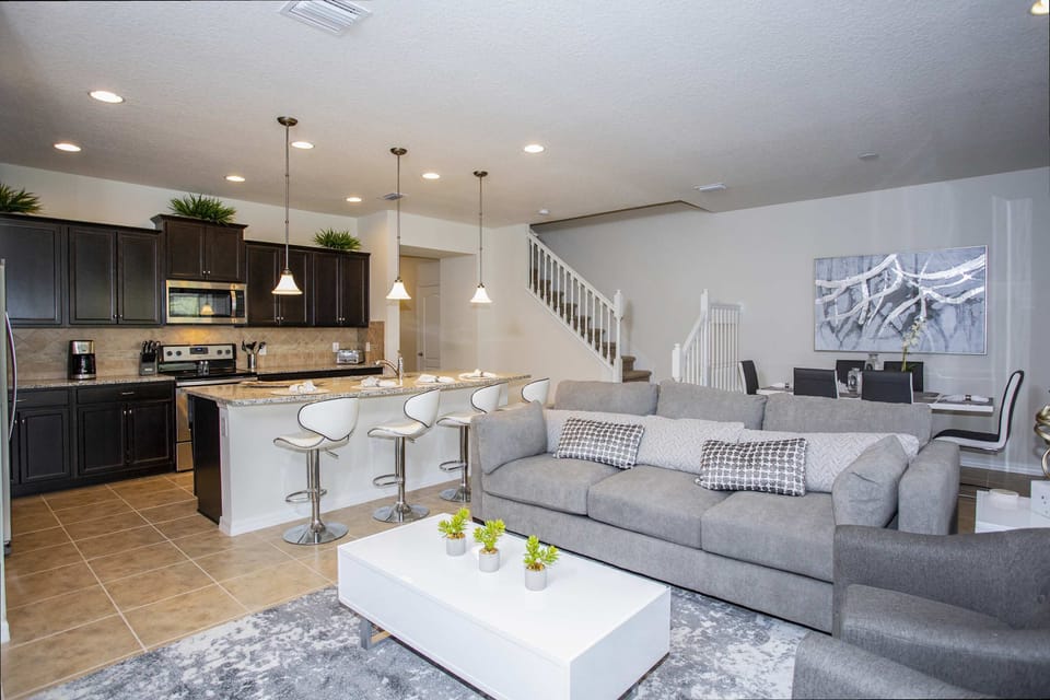 Bright and airy living space with plush seating and a Smart TV for family movie nights.