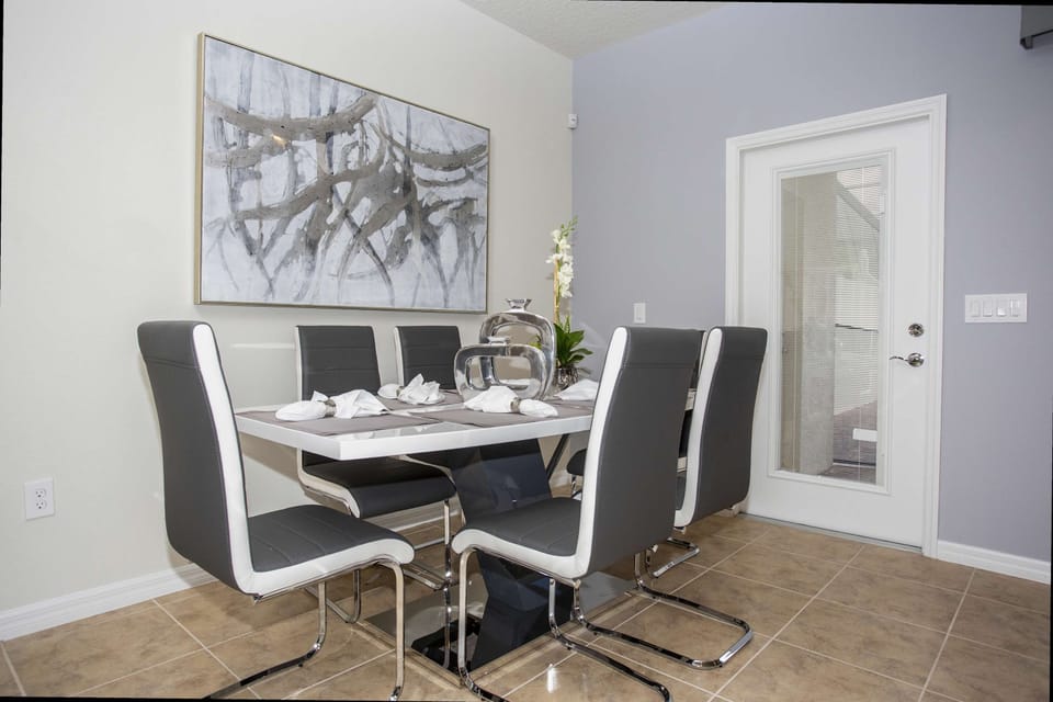 Enjoy meals together in this elegant dining area with seating for everyone.