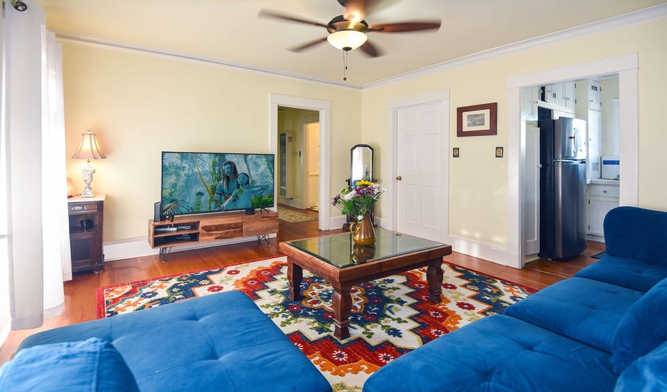 Living Room w/ Kitchen entry, xtra storage, hallway to bedrooms (right to left)