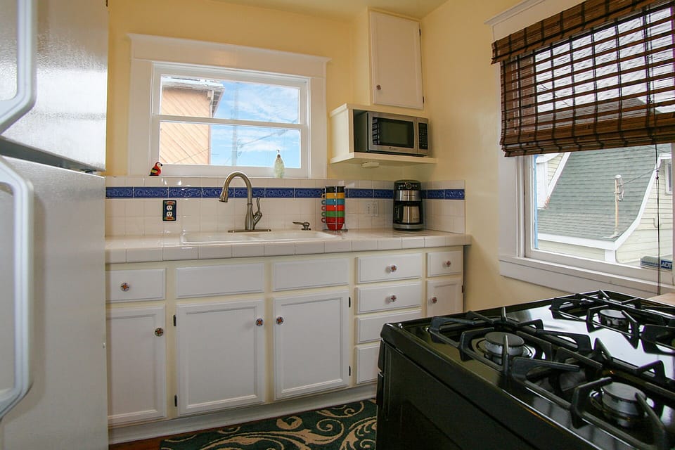 Fully Equipped Kitchen: toaster oven, gas range, cookware, and amenities