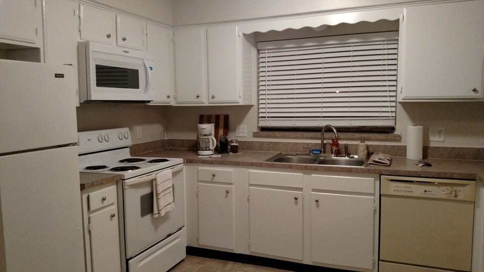 Open kitchen is fully furnished with all a cook could want!